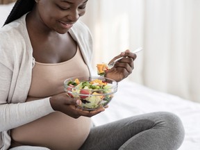 Black Pregnant Woman Holding Bowl With Fresh Vegetable Salad, Enjoying Healthy Nutrition