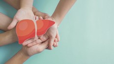 Hands holding healthy liver, organ donation, hepatitis vaccination, liver cancer treatment, world hepatitis day