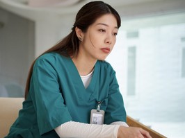 Stressed frustrated nurse thinking about patient she lost in surgery