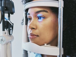 Ophthalmology, medical and eye exam with black woman and consulting for vision, healthcare and glaucoma check. Laser, light and innovation with face of patient and machine for scanning and optometry