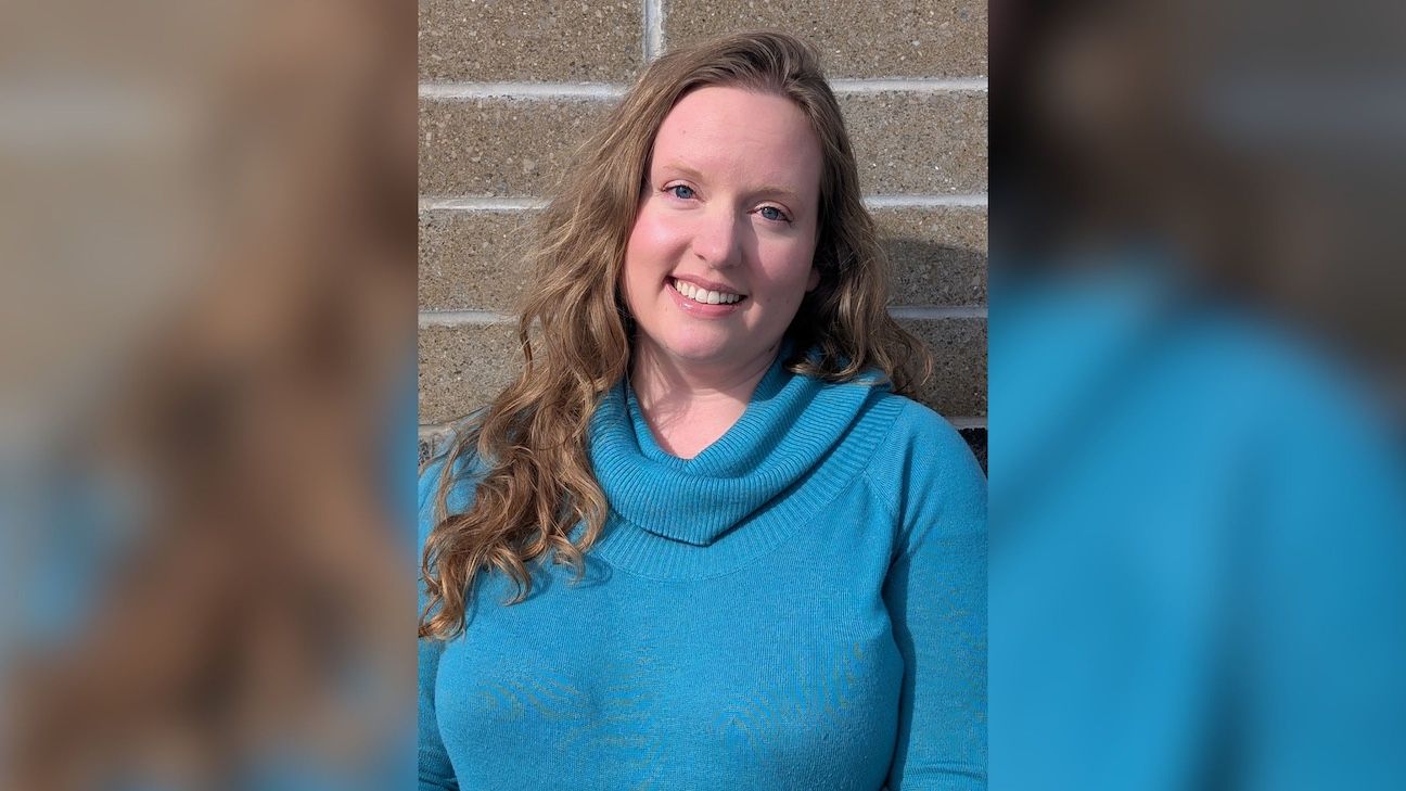 Portrait of young women, Kara Dymond smiling into the camera.