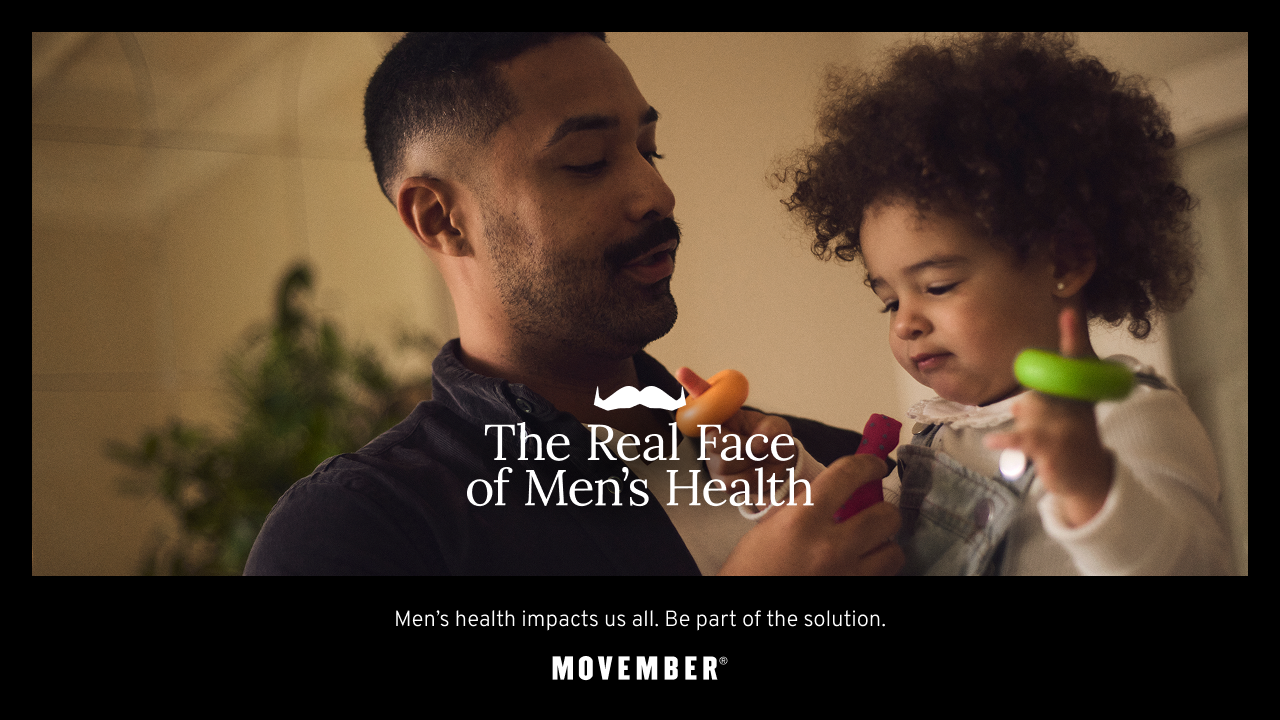 father holding his son. father talking to his toddler son in his arms.