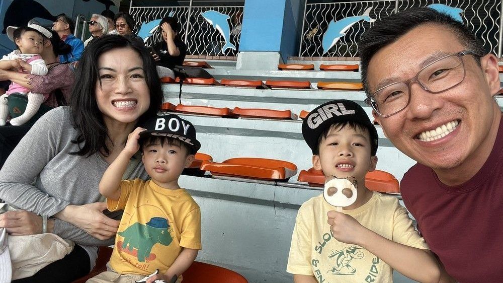 chris ho (r) with his family —sons caden and liam and wife maggie (l). chris ho was diagnosed with testicular cancer at the age of 32.