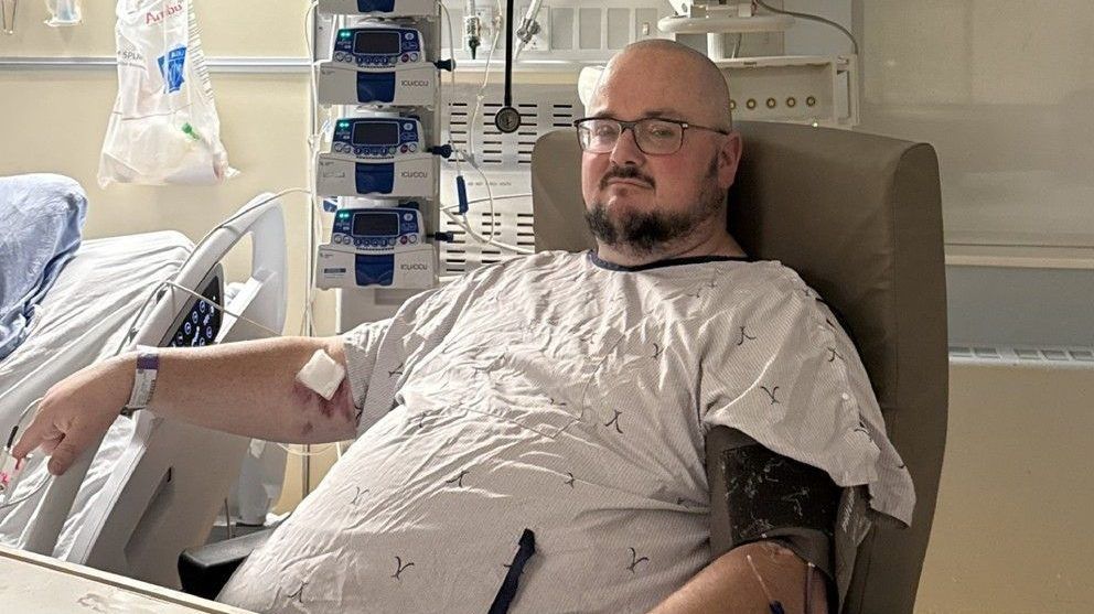 Jeffery Reynolds. Man in the hospital wearing a hospital gown receiving treatment,