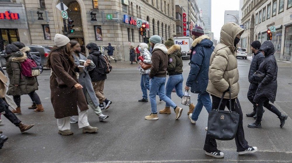 Pedestrians cross Metcalfe St. while walking on Ste-Catherine St. in downtown Montreal. Montreal is considered Canada’s second-most walkable city, based on the appreciation of walking among the city’s many historical buildings and the large number of cafés, markets, restaurants and green spaces within walking distance of most of its residents.