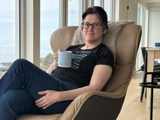 Woman relaxing in comfy chair.