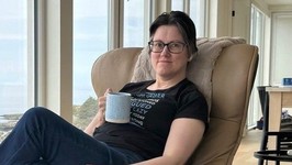 woman relaxing in comfy chair.