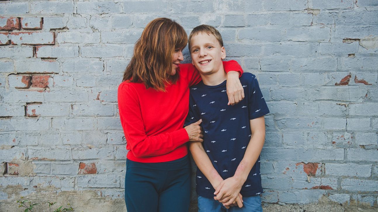 Mom Karen poses with her son Quinton for a photo.