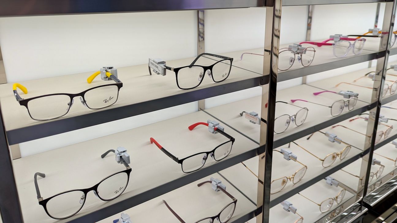 Wall of children's glasses on a shelf in a store.