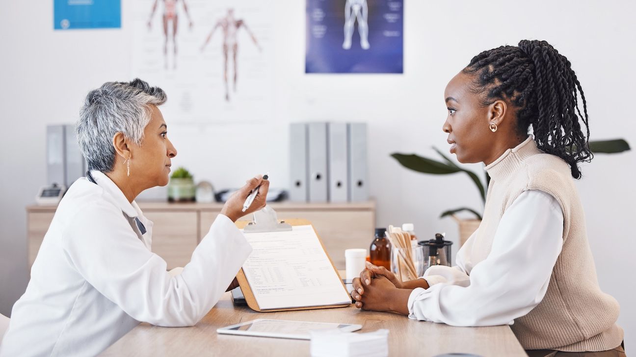 doctor with black woman in office for medical, checklist and results.