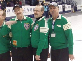Don Gardiner (left) and Bob Ellert (right) with the Krupski brothers were rocking their old-school curling sweaters after Wednesday's opening ceremonies