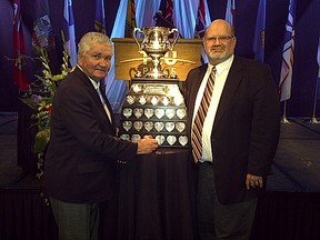 Two curling legends - Sam Richardson, the Brier Trophy - and me on the right.