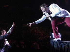 Johnny Reid reached out and connected with a soldout audience at the Brandt Centre on Tuesday night. Photo by Troy Fleece/Leader-Post