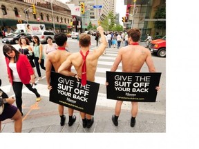 The Moores boys pose for a photo at the intersection of Yonge and Bloor in Toronto in support of the Canadian Suit Drive.