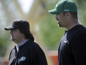 GM Brendan Taman (left) and assistant GM Jeremy O'Day have been regulars at the Riders workouts(Bryan Schlosser/ Regina Leader-Post.)