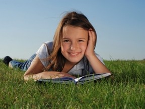 Summer Learning 2012 - Girl Reading on Grass SMALLER FOR PETER