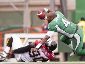Chris McCoy was assessed a face-masking penalty after removing  Darian Durant's helmet (The Canadian Press/Liam Richards)