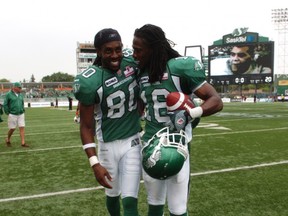 Efrem Hill (left) during happier times with the Riders' Eddie Russ. Hill tweeted he was released on Tuesday (Michael Bell/Leader-Post)
