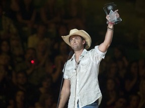 Dean Brody celebrating after winning the CCMA for album of the year on Sunday night. Photo Liam Richards/Canadian Press