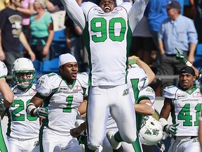 Brent Hawkins (90) was flying high after Sandro DeAngelis's game-winning field goal (THE CANADIAN PRESS/John Woods)