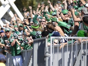 Weston Dressler was welcomed into the grandstands after scoring a touchdown during the Labour Day Classic on Sunday (Michael Bell/Leader-Post)