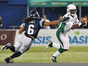 Darian Durant (4) remains eludes the grasp of Toronto's Marcus Ball on Monday (THE CANADIAN PRESS/Aaron Vincent Elkaim)