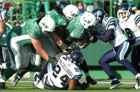 Running back Kory Sheets (1) had help from Brendon LaBatte (57) and Xavier Fulton on this touchdown run Saturday (MICHAEL BELL/Leader-Post)