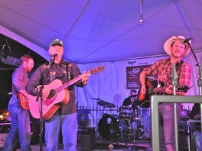 Premier Brad Wall sings with Blake Berglund and Kennedy Rodeo at the Home's Home Howl.