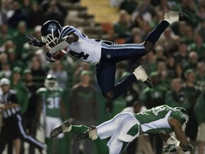 Riders safety Tyron Brackenridge sends Toronto's Jerious Norwood flying with this tackle (THE CANADIAN PRESS/Liam Richards)