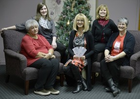 Initial payments were presented before Christmas to representatives of the four shelters supported by the Leader-Post Christmas Cheer Fund. Left to right: Margaret Crowe of WISH Safe House, Amy Stensrud of the YWCA Regina's Isabel Johnson Shelter, Irene Seiberling of the Leader-Post Christmas Cheer Fund, Sarah Valli of SOFIA House and Maria Hendrika of Regina Transition House. PBRYAN SCHLOSSER/Leader-Post.