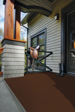 The richness of a wooden deck is an ideal backdrop for a stylish outdoor space. A dark brown stain, such as Mountain Shelter (1713-503) by SICO® paint, pictured on the base of this deck, coordinates well with light grey siding. SICO photo