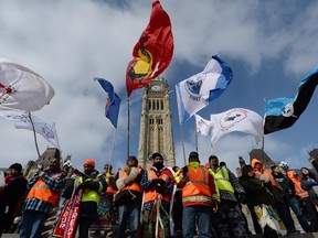 A group of First Nations adults and youth finish a spiritual journey from Attawapiskat First Nation to Parliament Hill in Ottawa on Monday, February 24, 2014.