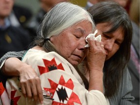 Residential school survivor Lorna Standingready is comforted by a fellow survivor in the audience during the closing ceremony of the Indian Residential Schools Truth and Reconciliation Commission, at Rideau Hall in Ottawa on Wednesday, June 3, 2015.