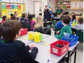 Among cluttered aisles of binders, loose leaf and pencils, stressed parents and excited kids scouted the goods Tuesday, preparing for the new school year. (Photo by Bruce Edwards / Edmonton Journal)