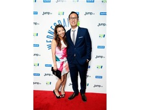 Anna Shim, left, and Andy Cho attend the Wednesday Night Live!,an event in support of Jon Ryan’s new charity Gear Up, in Regina on Wednesday.