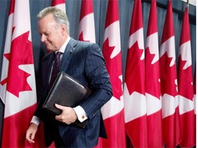 Bank of Canada Governor Stephen Poloz leaves a news conference in Ottawa, Wednesday July 15, 2015.  Many economists think the BOC has gone as far as it can go to boost the economy.THE CANADIAN PRESS/Adrian Wyld
