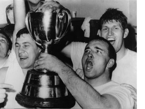 Al Benecick, shown on the right holding the Grey Cup, celebrates the first championship-game victory in Saskatchewan Roughriders history on Nov. 26, 1966 in Vancouver.