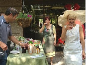 Bernadette McIntyre (right) and Nancy McEwen enjoy a drink from Trevor Doroshenko of Local and Fresh at the launch of the Divas in the Park - An Ungolfing Experience to be held August 13.