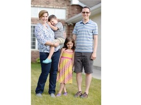 Brenda Baisley and her husband Chris Beingessner along with their two children Nolan and Norah pose for a portrait in Regina on Thursday.
