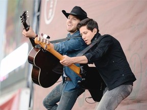 Brett Kissel (left) and bass player Justin Kudding (right) perform at the Craven Country Jamboree on Saturday. (Michael Bell/Regina Leader-Post)