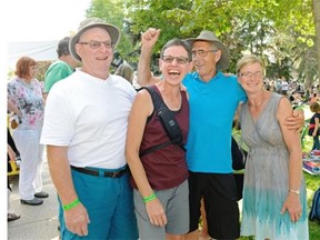 Brian and Bean Sauer (left) wait in line with their friends Jim and Cindy Friesen (right) at the Regina Folk Festival on Sunday August 9, 2015.