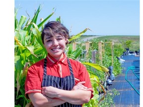 Chef Mariana Brito shows off her large garden, which she farms with Over the Hill Orchards owner Dean Kreutzer. The harvest, along with locally sourced ingredients, is used in all her dishes. Photo by CJ Katz