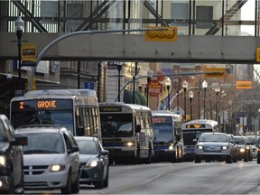 City of Regina transit buses line 11th Avenue.