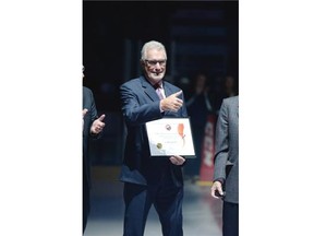 Clark Gillies gives a thumbs-up after receiving a WHL alumni achievement award at the Brandt Centre in Regina, Sask. on Saturday Sep. 26, 2015. (Michael Bell/Regina Leader-Post)