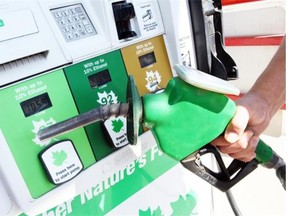 A customer filling up at the Husky Gas Bar on Park Street in Regina June 11, 2015. Gas prices shot up by 13 cents a litre at many major gas stations in town on Thursday from an average of 108.5 cents yesterday. GasBuddy.com issued a price hike alert for Regina, warning that prices could be “jumping in your area’’ to 121.9 cents a litre.  (DON HEALY/LEADER POST)