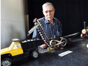 Dick Moulding with his exhibition of fully operational farm machinery miniatures on display at New Dance Horizons. DON HEALY/Regina Leader-Post