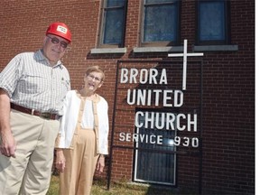 Dwayne Pearce and Janet Mickleborough in front of Brora United Church East of Condie on June 24, 2015. On Sunday Dwayne is doing a history of the church which is slated to close and be sold as a house. The couple getting married in the church this weekend is also buying the church and turning it into the house. Janet’s granddaughter is the bride.