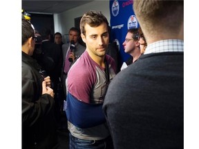 Edmonton Oilers right-winger Jordan Eberle speaks with the media with his right arm in a sling as the players practise Wednesday. Eberle, a former star with the WHL’s Regina Pats, will be out of the lineup for four to six weeks with a shoulder injury.