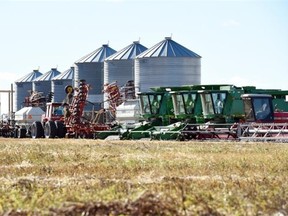 Farm machinery sits idle in a field north of Regina last week. Harvest operations are 97 per cent complete across the province.