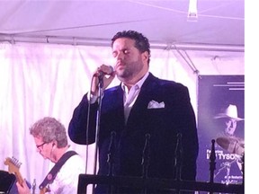 Fernando Varela, accompanied by Jack Semple (in background) performed Saturday, July 18 at the Hope's Home Howl, a fundraiser to help provide respite care for families with children with complex medical needs. Hope's Home is Canada's first medical day care. IRENE SEIBERLING/Leader-Post